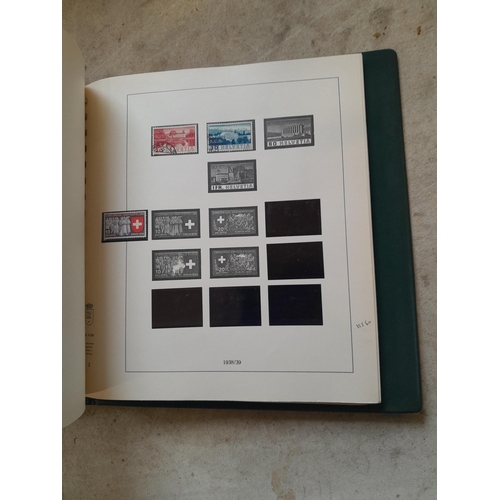 183 - Stamps of Switzerland  in a Linder album remaindered but some better stamps still present