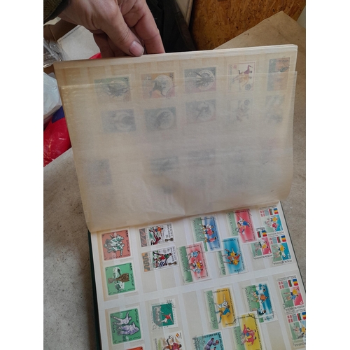 216 - Stamps: World Collection a varied array of Commonwealth and world stamps 32 well filled pages in a L... 
