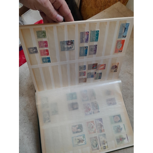 216 - Stamps: World Collection a varied array of Commonwealth and world stamps 32 well filled pages in a L... 