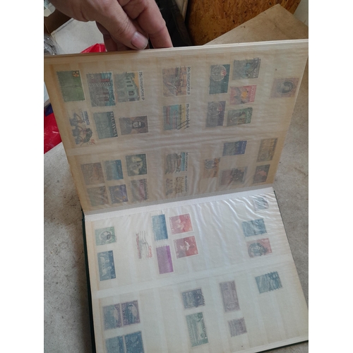 216 - Stamps: World Collection a varied array of Commonwealth and world stamps 32 well filled pages in a L... 