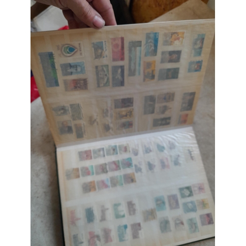 216 - Stamps: World Collection a varied array of Commonwealth and world stamps 32 well filled pages in a L... 