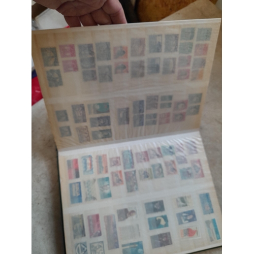 216 - Stamps: World Collection a varied array of Commonwealth and world stamps 32 well filled pages in a L... 