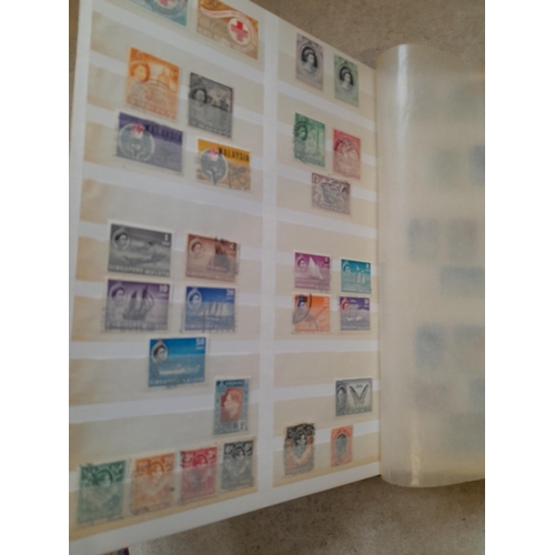 216 - Stamps: World Collection a varied array of Commonwealth and world stamps 32 well filled pages in a L... 