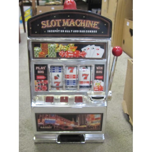 97 - Box to Include Slot Machine Game, Door Chimes & Pressure Sprayer.