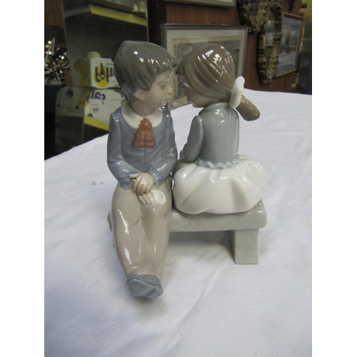 338 - NAO Figure of Boy & Girl on Bench.