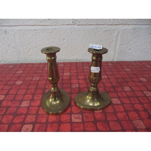 210 - Pair of Brass Candlesticks.