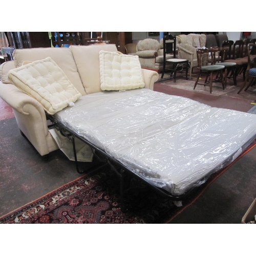 537 - Cream Upholstered Two Seater Fold-out Sofa Settee Bed.