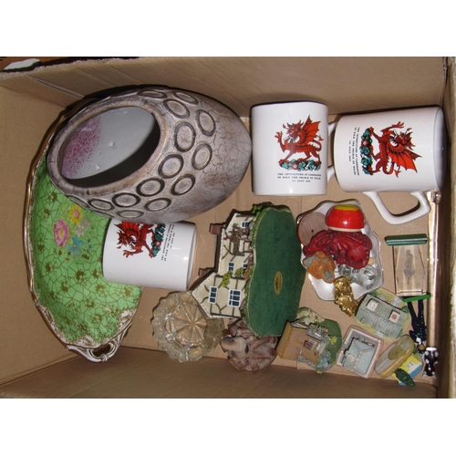 87 - Box of China to Include Cottage Figures, Vase, Welsh Mugs etc.