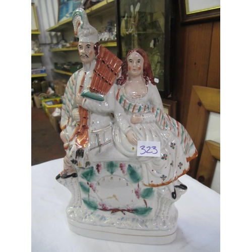 323 - Scottish Couple Staffordshire Flat Back Clock Figure.