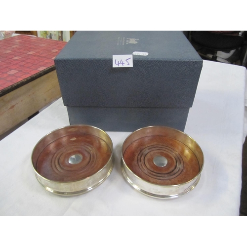 445 - Two Boxed Hallmarked Silver Wine Bottle Coasters.