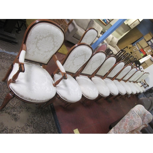 506 - Set of 10 Yew with Cream Upholstered Seat Dining Chairs and Two Matching Carvers.