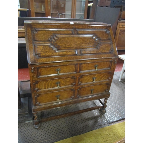 520 - Oak Carved Front Writing Bureau Over 3 Drawers.