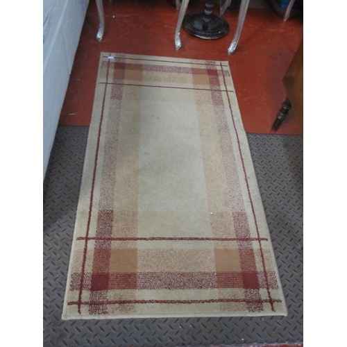 530 - Rectangular Brown & Red Patterned Rug.