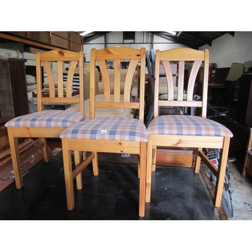 544 - Three Matching Pine Dining Chairs with Upholstered Seats.