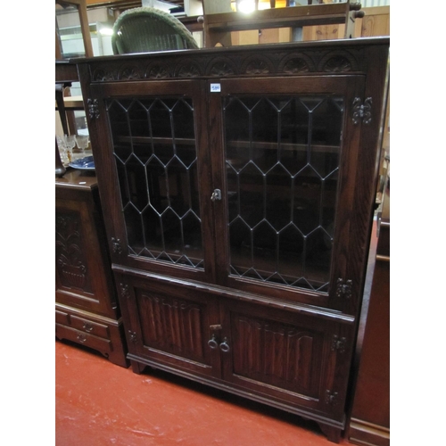 580 - 2 Leaded Glass Door Oak Cabinet by Jaycee Furniture over Double Cupboard.