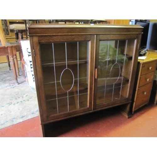 642 - Oak Leaded Glass Double Door Bookcase on Legs.