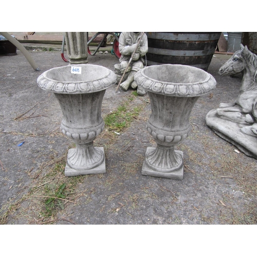 668 - Pair of Concrete Garden Urns.