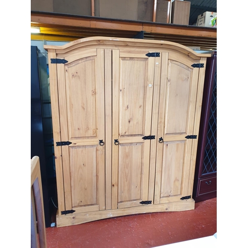 531 - Solid Pine Triple Wardrobe with Hanging Rail & Shelves.