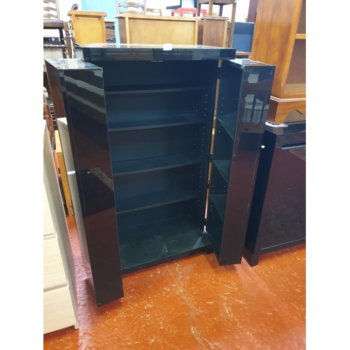 573 - Black Gloss Finish Two Fold Out Door DVD Cabinet.