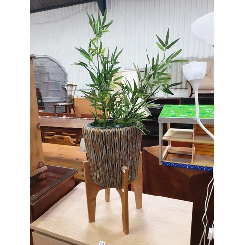 577 - Circular Woven Plant Holder on Wooden Base with Artificial Bamboo Plant.