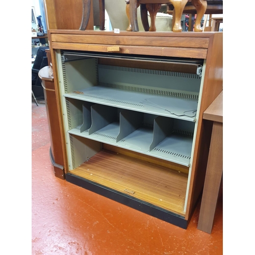 586 - Roller Front Office Cabinet with Metal Inner Shelves & Dividers.