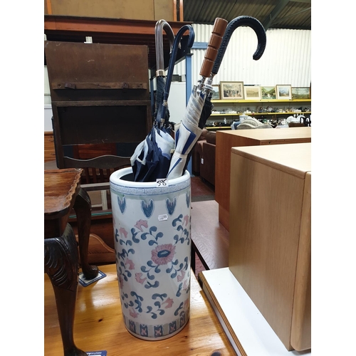 595 - Ceramic Umbrella Stand with Quantity of Umbrellas.