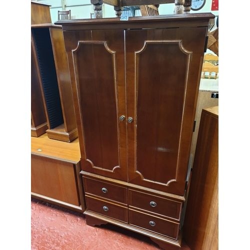 602 - Yew HiFi Cabinet with Bifold Doors over Two Cupboards.