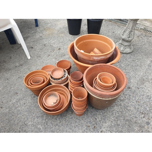 691 - Large Quantity of Terracotta Plant Pots & Saucers.