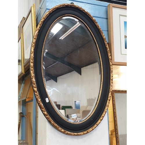 443 - Gilt & Black Framed Oval Wall Mirror.