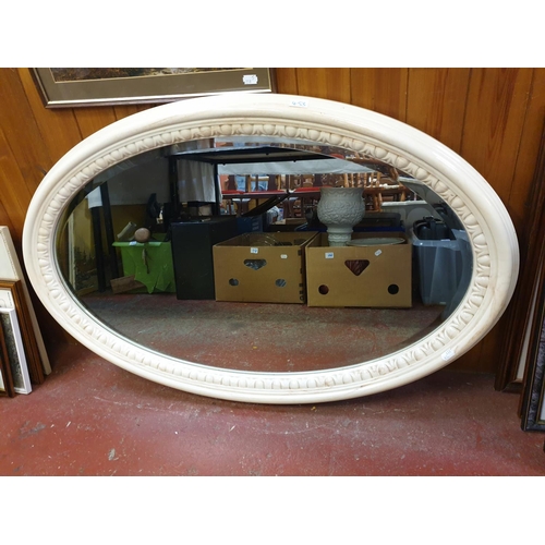 453 - Heavy Cream Marble/Resin Framed Oval Wall Mirror.