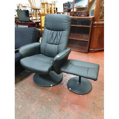 490 - Leather Effect Black Swivel Recliner Chair and Stool.