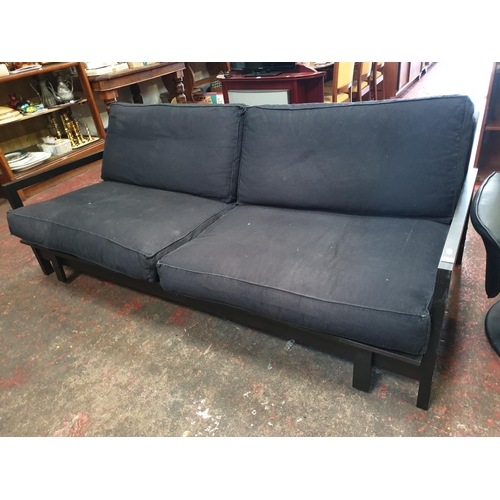 491 - Black Two Seater Fold Out Sofa Bed.