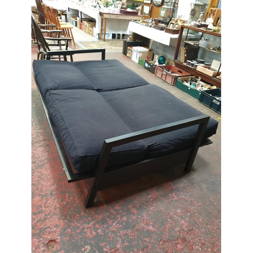 491 - Black Two Seater Fold Out Sofa Bed.