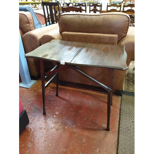 492a - Tall Folding Mahogany Table.