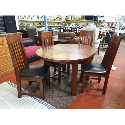 493a - Stunning Extendable Circular Dining Table with 4 Matching Chairs.