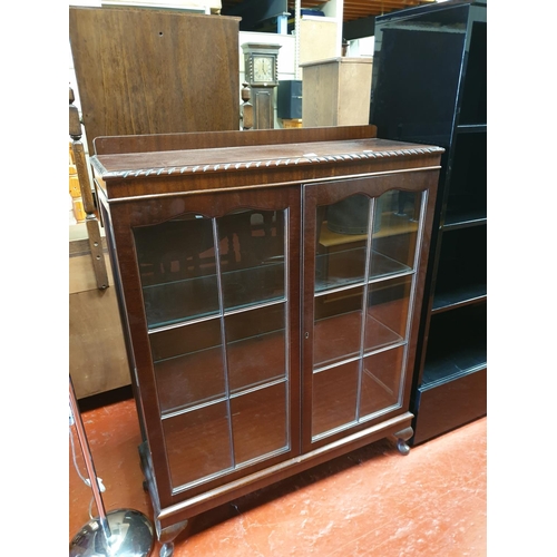 555 - Glazed Two Door Oak Display Cabinet with Pie Crust Edge & Glass Shelves.