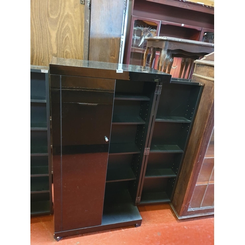 569 - Black Gloss Finish 2 Door Fold Out DVD Cabinet.