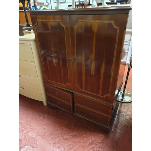 590 - Yew TV Cabinet with Bifold Doors over Double Cupboard.