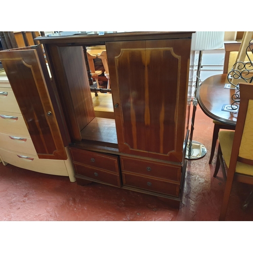 590 - Yew TV Cabinet with Bifold Doors over Double Cupboard.