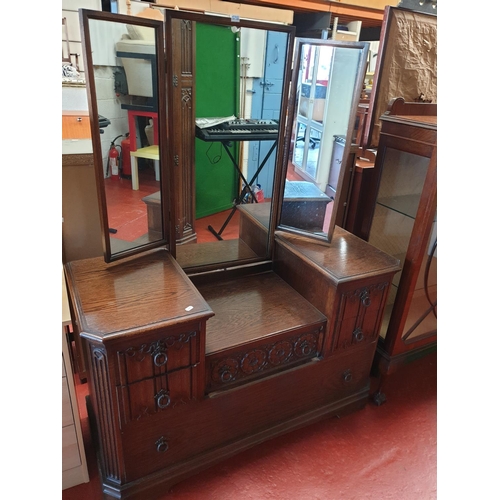 598 - Oak Linen Fold Triple Mirror Topped Dressing Table with Six Drawers.