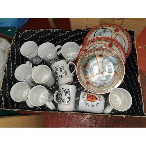 151 - Box of Tiger Mugs & Oriental Plates.