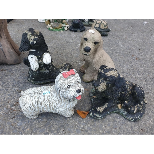 627 - Four Small Concrete Garden Dog Ornaments.