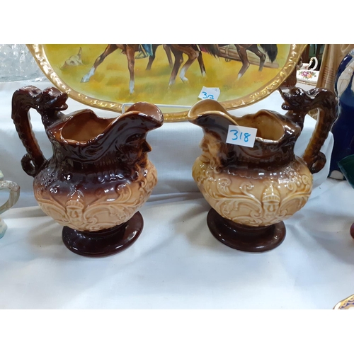 318 - Pair of Brown Glazed Treacle Jugs.