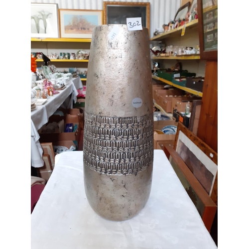 302 - Hand Made Pottery Vase with Silvered Finish.