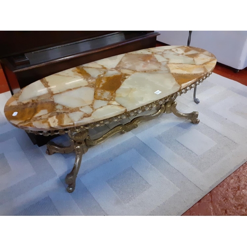 506 - Onyx Topped Oval Coffee Table on Gilded Base.