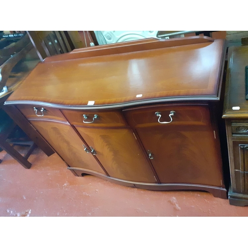 569 - Wavy Front Mahogany 3 Drawer 3 Door Sideboard.