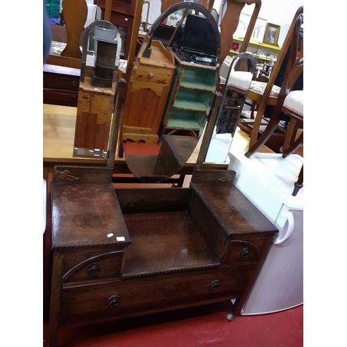 556 - Dark Oak Three Drawer Triple Mirrored Dressing Table.