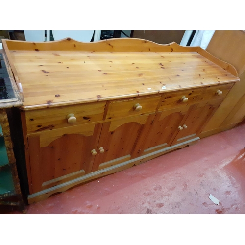 588 - Large Solid Pine Side Board with Four Cupboards & Four Drawers and Gallery Top.