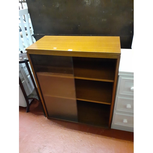 619 - Glazed Sliding Door Bookcase.