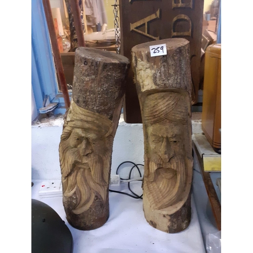 259 - Two Carved Logs.